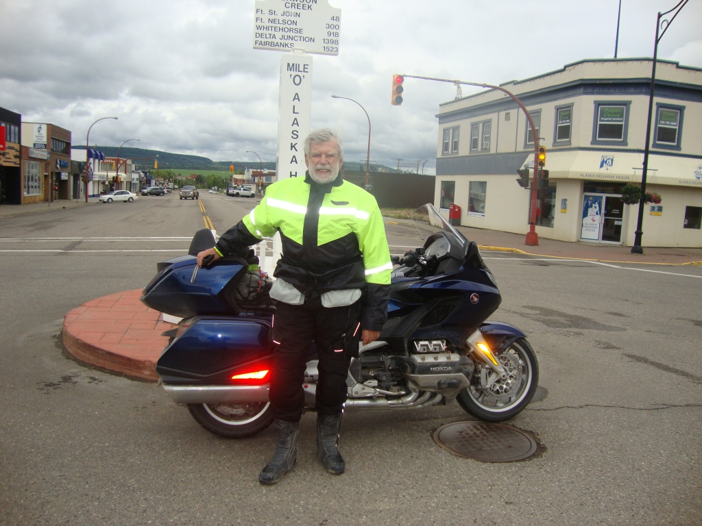 On Day 6, Monday July 2, it was only 9:00 AM when I arrived at the Zero Milepost in a deserted "downtown" Dawson Creek. Finally a patient and kind man, discerning what I'd like, volunteered as photographer. He was only the second person I saw at this "city center."