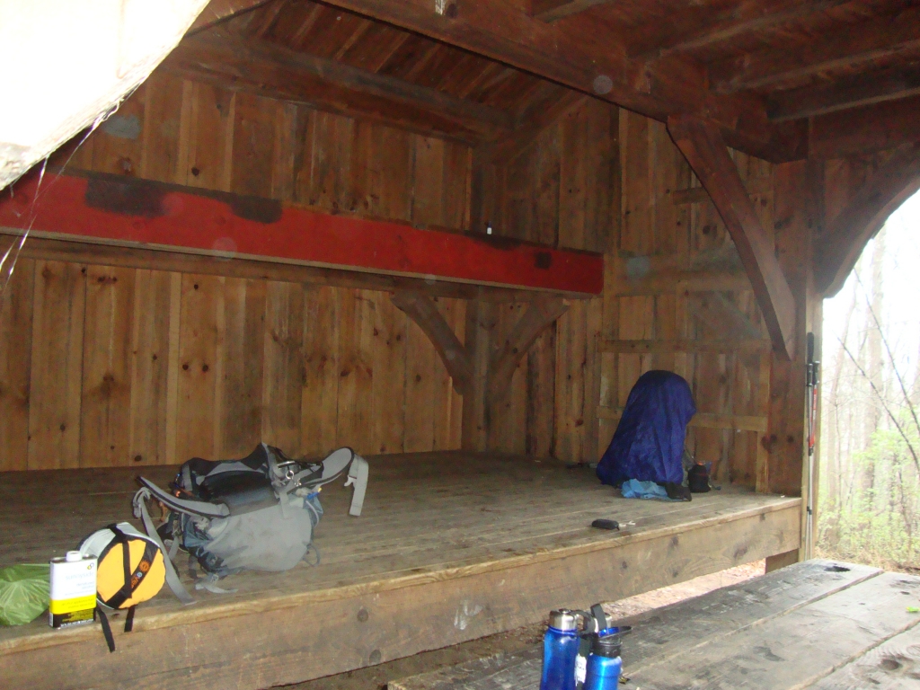 Plumorchard, shortly before I left at 9:55 AM, Monday March 18; my covered pack is at the right, Josh's things at the left. This unique shelter had 3 levels: two visible here, the third a loft above the picnic table, accessed by the steps on the right wall.