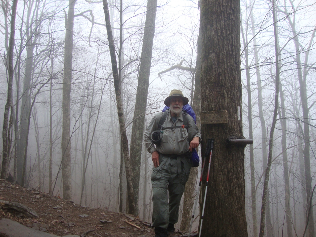 The misty, overcast morning featured sleet and 100-yard visibility, with rain gear off and on, but some of the walking was pleasant. This landmark, the Georgia - North Carolina state line, arrived shortly before 1:00 PM.