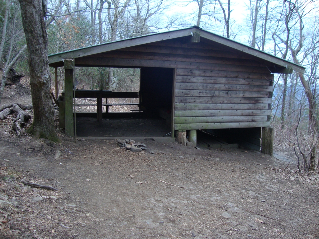 Carter Gap Shelter, 8:15 AM. There was ice in our water when we arose. Mozyin seemed to sleep well, but Phoenix --- hoping his enclosed tent would be warmer --- and I tossed and turned in the cold, snatching sleep in many short pieces. I pulled out at about 9:00 AM.