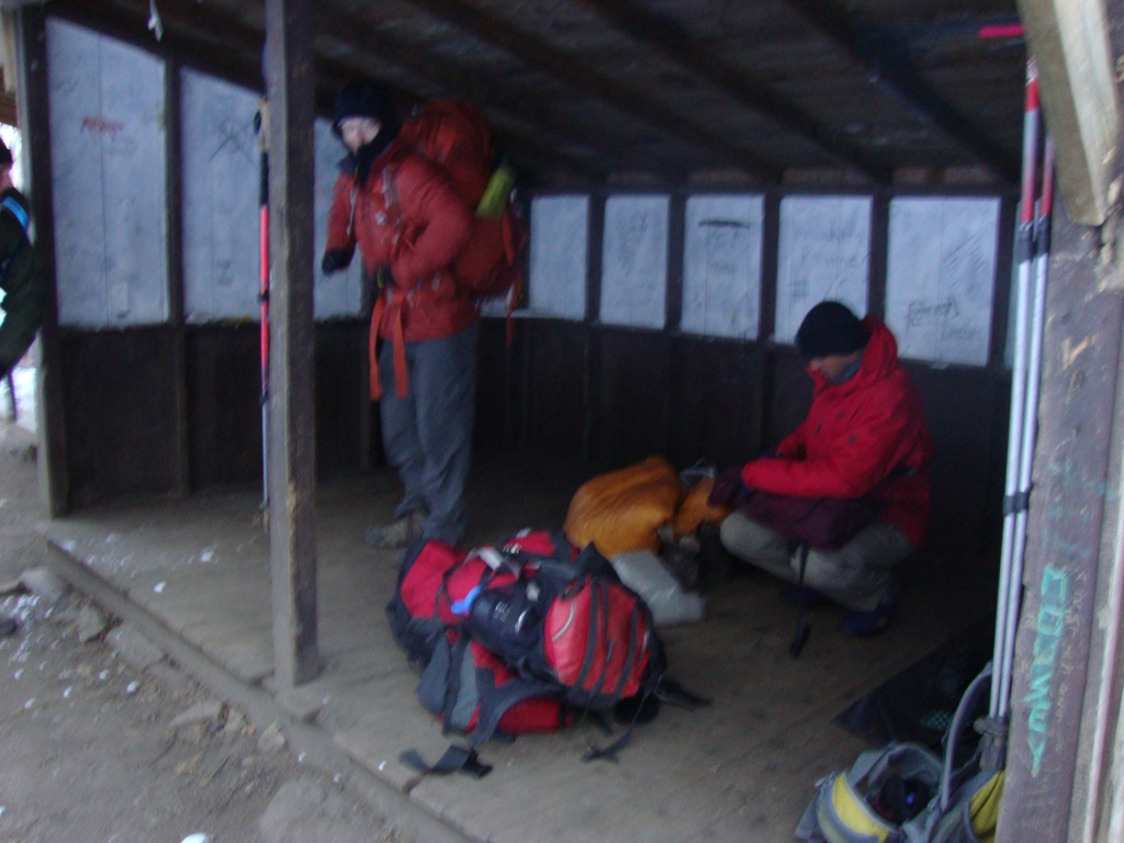 At 8:00 AM, everyone but these two fellows and me has left (and they're on their way!), hustling the 2 miles north to Winding Stair Gap to catch Ron Haven's shuttle to Franklin. I seemed to be alone in thinking he also picked up at Rock Gap, just 0.1 mile away and within sight of the shelter! This made me very nervous... but the shuttle van rescued me from the frigid, windy Rock Gap parking area about 9:30 AM!