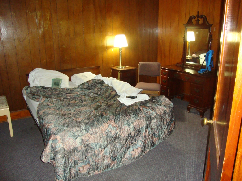 The bedroom had a better television set, and its bathroom had a shower curtain!