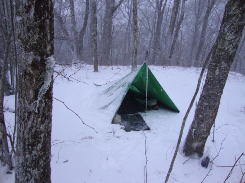 Finding the shelter full, I camped on a high ridge east of the trail. Despite the snow and rain, and a ~15F temperature (all water was frozen), I was actually warm and dry in there. Several of my fellow NOBOs expressed amazement that I'd weathered this stiff night in this camp!