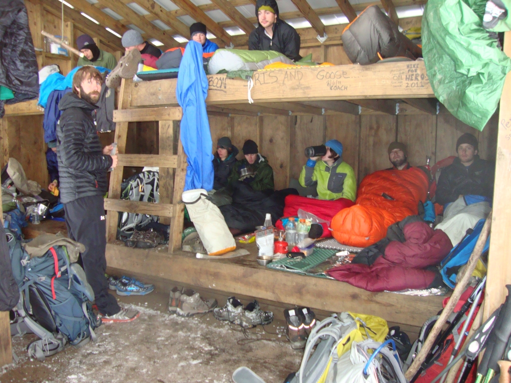 We arrived at Sassafrass Gap Shelter early, about 3:00 PM, but still found it full. Tallulah (the Maine boy from Stover Creek on March 11!), in the orange bag, persuaded others to let me sleep on the outer edge of the platform, perpendicular to the others' feet. That's my maroon bag, and green Z-Rest pad. Tenderfoot, and my NOC bunkmates Condor and Brad, tented nearby.