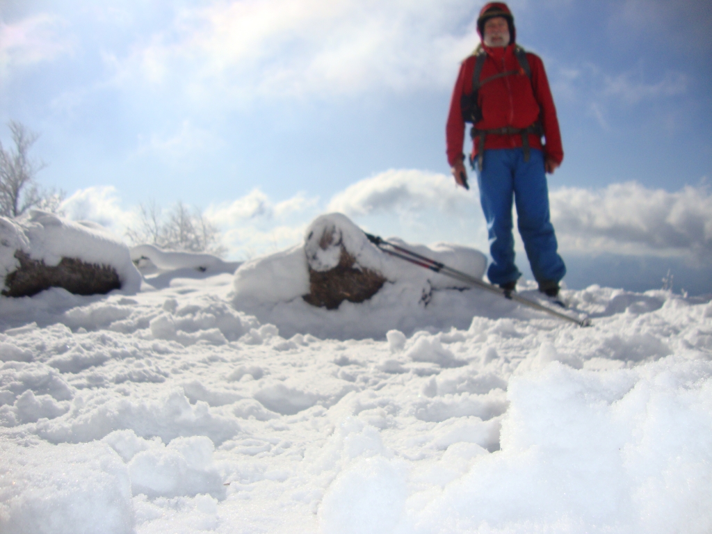 I left Sassafrass Gap Shelter at 8:50 AM, a little before Tenderfoot and Brad were ready. The Maine boys had broken the trail, through drifts sometimes knee high, despite sparse and/or snow-concealed blazes. There was a nice view here at Cheoah Bald at 9:45 AM but my ground-mounted short tripod couldn't capture it.