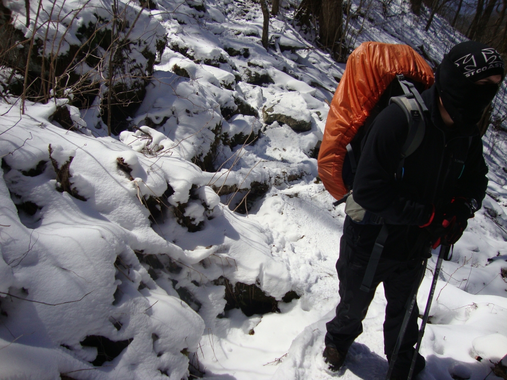 At 1:45 PM, Tenderfoot has just negotiated one of the frequent crossings of icy rock slides. We hated these things, so threatening to the ankles and knees with their many angles and icy rock faces and edges. But we never fell.