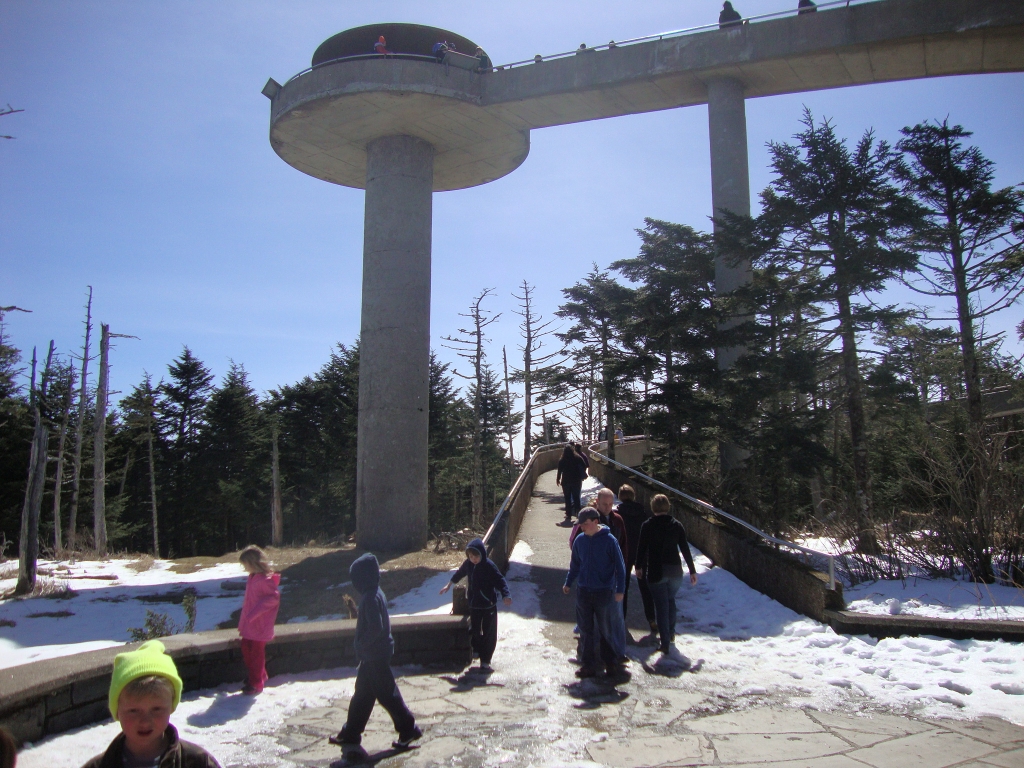 I'm down, looking back to the tower and heading back to the trail! It's 11:36 AM, time to put the MicroSpikes back on!