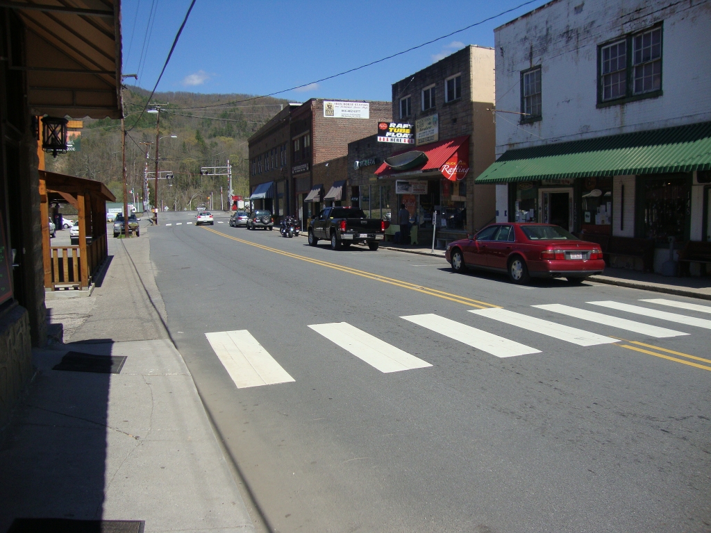 Iron Horse is square brick building with white rectangular sign; outfitters is near right edge of this photo.