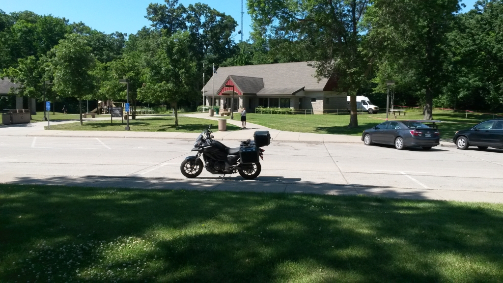 Day 11: I was following an RV this morning when a tire disintegrated and a flying chunk of rubber hit my helmet. A lesson! At this pleasant rest area, forty miles west of Minneapolis (which I dreaded), I stopped for lunch and coffee.