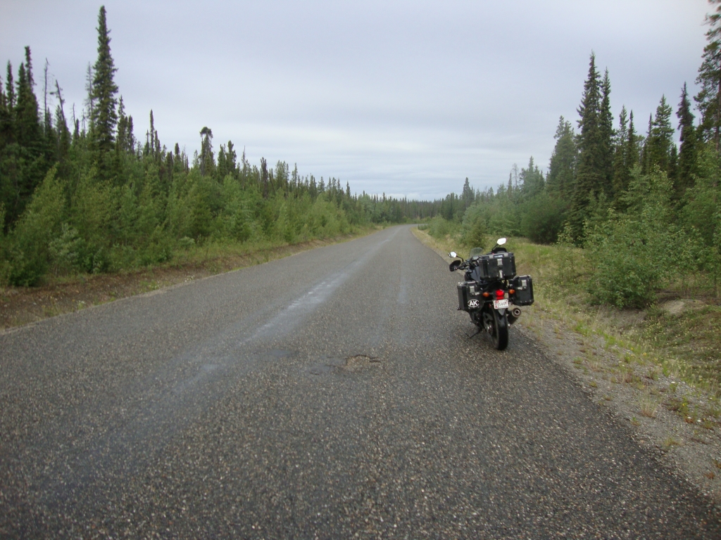 Day 4: This 8:30 AM shot gives a feel for the north end of the Cassiar Highway. Narrow, no painted lane or edge markings, and soft or zero shoulders... one had better stay alert!