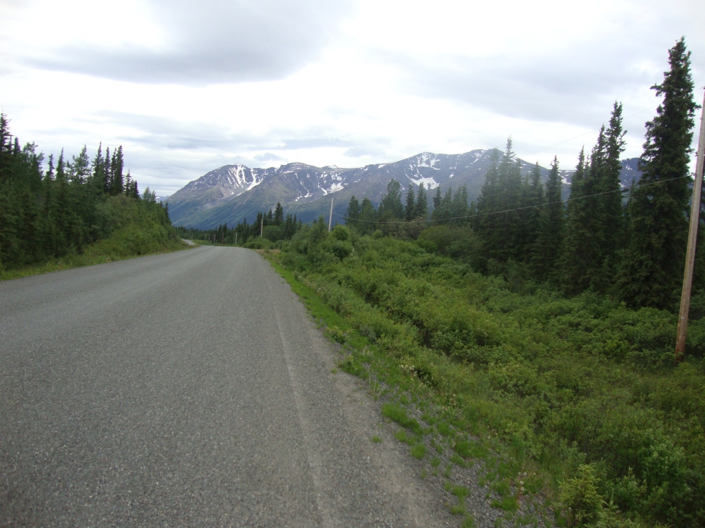 South of Dease Lake, mountains began to appear. I'd planned on spectacular photos tomorrow morning, but a thick gray blanket concealed the southern road's stunning peaks. I also had too much trouble with rain and difficult riding conditions to take photos.
