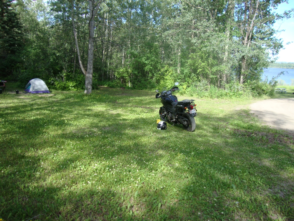 Night 5: Pipers Glen Resort, along Route 16 8 miles east of the town of Fraser Lake, was nice. But tenting seemed like an afterthought, with rough ground under that grass (that's why the X is parked so far from the tent) and rickety small picnic tables. 