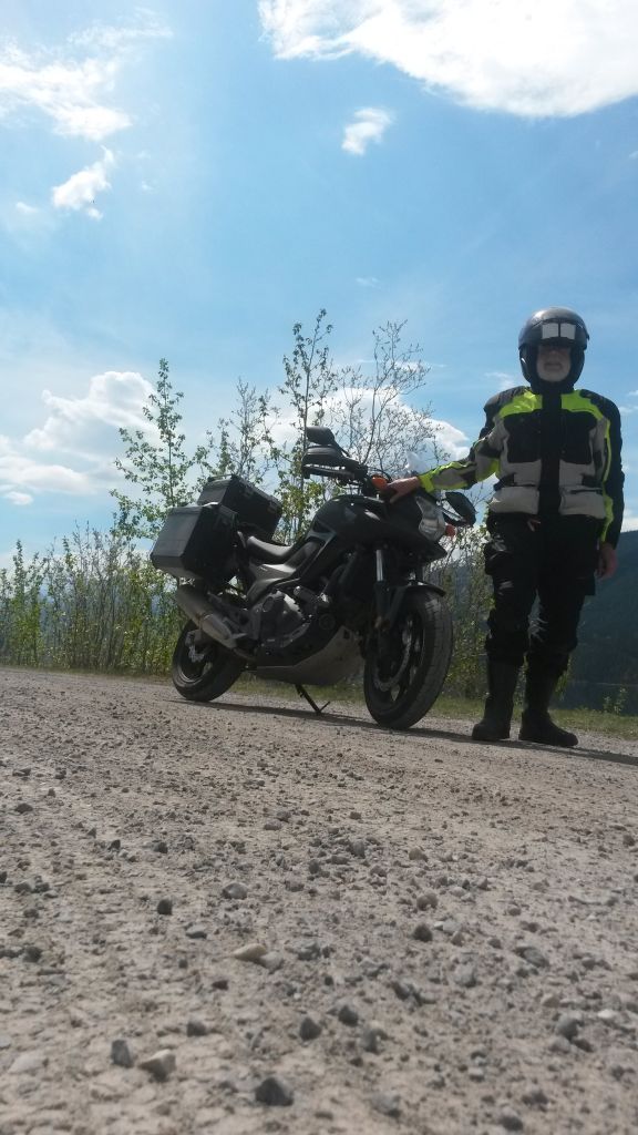 Day 12, along Muncho Lake: On Monday May 29 I stopped for a selfie along this beautiful lake, but the angle of propped cell phone prevents it from being seen! My second Joby tripod broke at its first use on this trip, at Oastler Lake.
