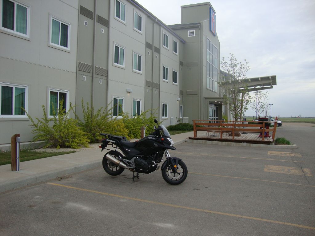 Day 7, Brandon MB: It was delightful to ride through the  Kenora region with crystal blue lakes, dark green firs, and massive rock outcroppings under blue sky with fluffy  white clouds. Moving away from the lakes toward the prairie, strong wind gusts became tough on my neck!