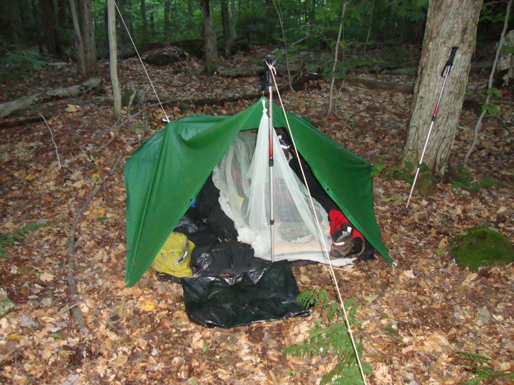 The mosquito net is a bit awkward, but it helps. This is the morning of my 6th day out (August 25, 2014). There was no water here; I had to walk back along the trail a short distance to fill a couple of containers.