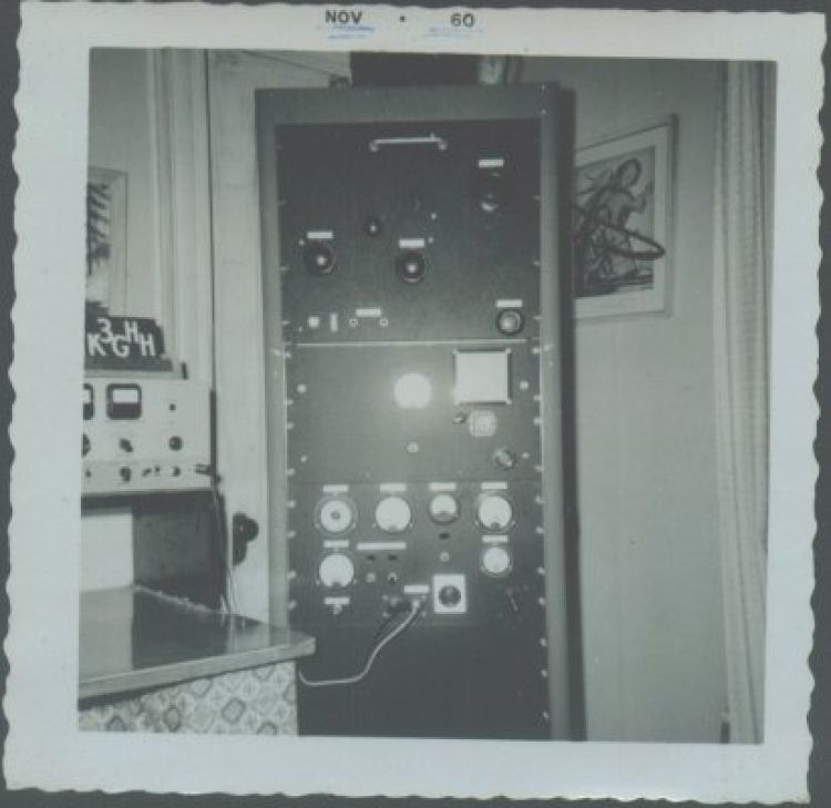 The W3MI transmitter. The BC-459 (used as VFO) is behind the chart in the second panel down, and the calibrated dial just below the chart frame. An external link-coupled antenna tuner sits on top of the 6-foot rack. Howard included a castered wooden dolly. The power supply, with a huge transformer, is at the bottom, and the modulator is just above it, behind the blank panel below the meters.
