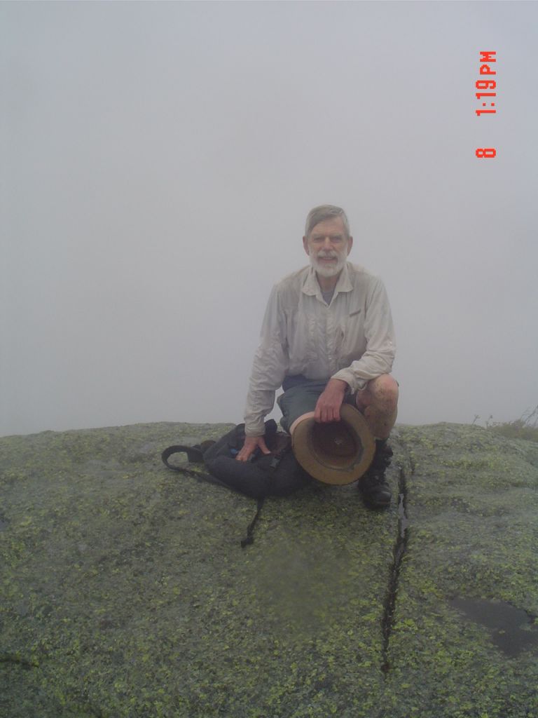 A pleasant young woman snapped my photo on the Basin summit at 1:18 PM. There were 8 other people hee, and a little rain.