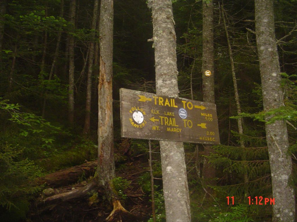 About 1:15 PM, I encountered this. Left to Marcy might be to Four Corners, but if I'm heading west right is north... and Elk Lake is south.