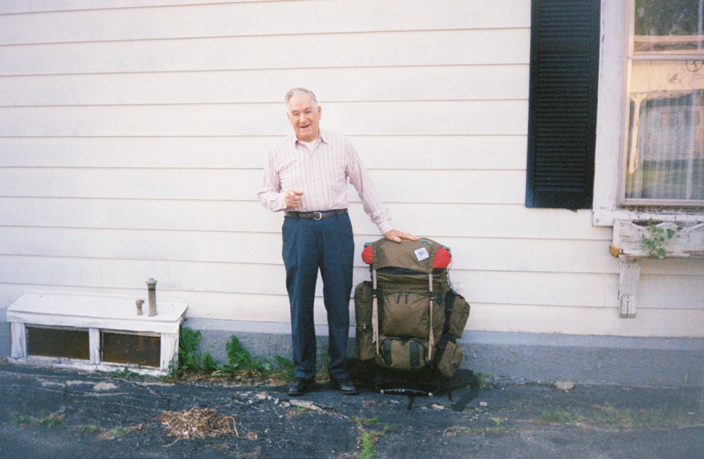 Genial proprietor Russ Plourde, Friday morning June 18 2004, with my pack. He's about to drive me to the bus at Newport; I'll spend 9 hours getting to Pittsfield MA.