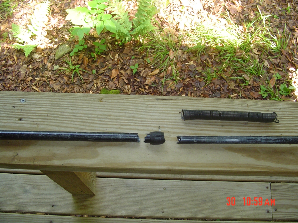 Matt, a ranger at the  Lodge, offered soft iron wire. I wound enough of it around the bottom section to create this spacer, long enough to set the right pole length. This pole was heavier than the other, but it worked! This disassembled photo shows the pole's break at its lower pin, a weak point with this type of pole.