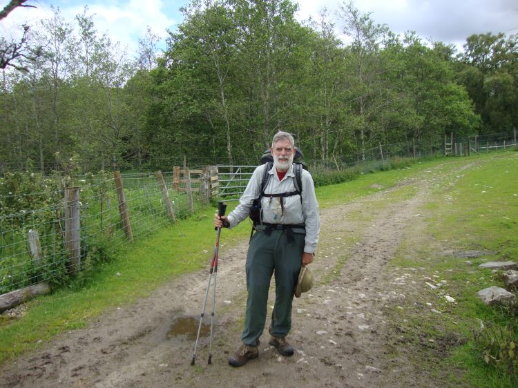 At 1:00 PM, I was around 24.5 miles at the Allt Eoghainn stream when I met a nice couple, perhaps father and daughter, who took this photo. My path ahead is uphill behind me, toward the Woods of Knockfrink. There was a lot of climbing, and a lot of mud, on my third day!