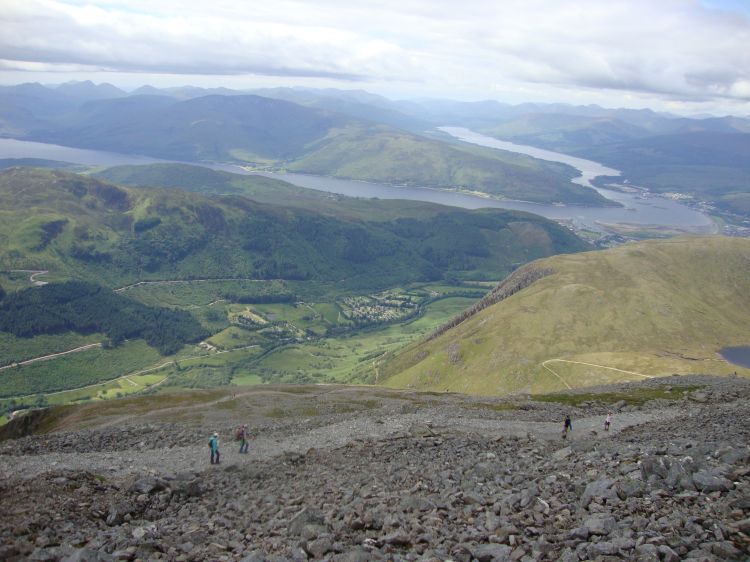 This 2:52 PM photo shows more than shots from the summit. Fort William is above the light-brown hill; Loch Eil points upward and left and the long inlet to the Atlantic Ocean to the left. Glen Nevis is below. I reached my campsite at 5:20 PM, enjoyed some snacks from the campground shop, and began preparing for the next phase of my trip! 