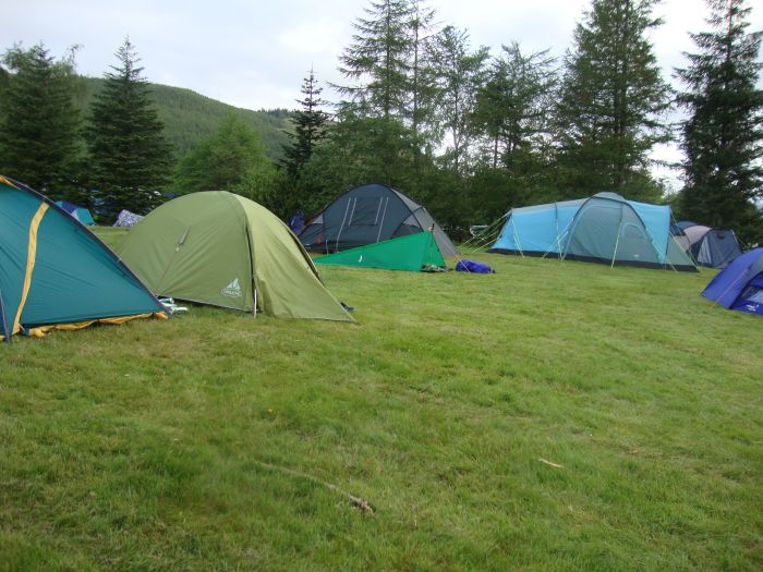 Ah, the humble tarp in a sea of huge, heavy relatives! Glen Nevis Campground, 6:00 AM, Saturday (6/4/11, Day 9). The World Cup downhill mountain bike race was this weekend near Glen Nevis, and the campground was filled with competitors and mechanics from all over the world.